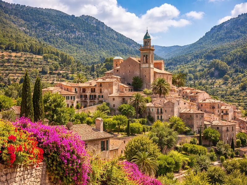 Valldemossa village in Serra de Tramuntana Mallorca – stone houses, Cartuja monastery and mountain scenery